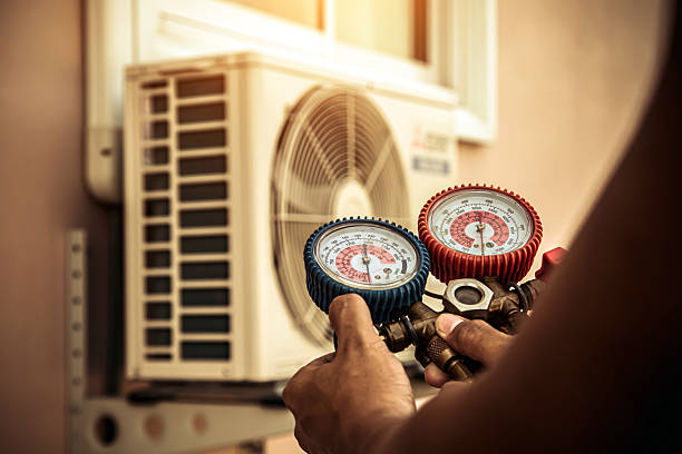 Professional Air Conditioning Service technician working in Urbana, IA
